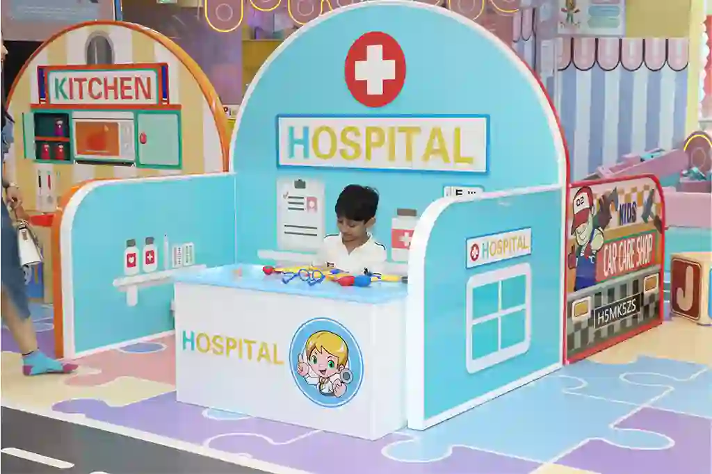 Toddler enjoying a hospital role-play activity that encourages sensory play, imagination, and early brain development at Funblock.