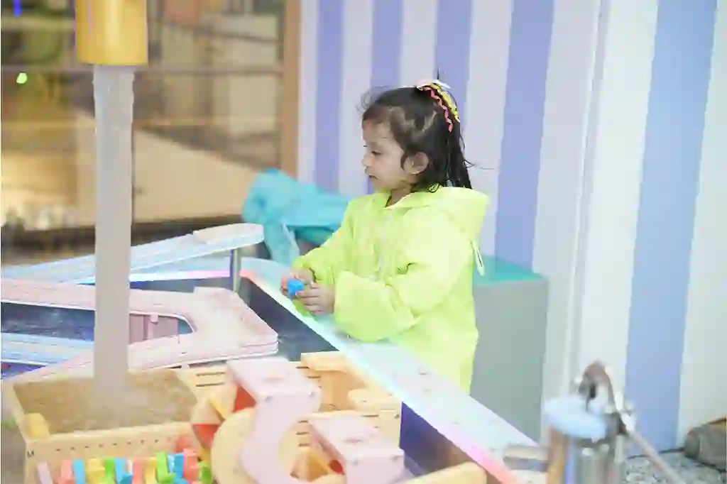 Young child exploring hands-on sensory play activities that support brain development, creativity, and fine motor skills at Funblock.